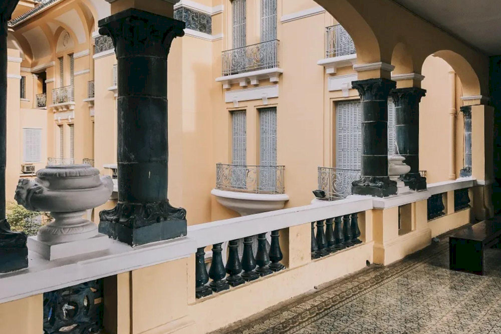 The hallways, with their vintage lighting and patterned tile floors, add a timeless and artistic touch to any shot